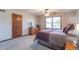 Spacious main bedroom featuring carpet flooring, natural light, dresser, and ample space at 6530 Grant Wood Ct, Indianapolis, IN 46256
