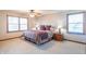 Cozy main bedroom with natural light, ceiling fan, neutral walls, carpet flooring and privacy blinds at 6530 Grant Wood Ct, Indianapolis, IN 46256