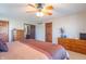 Comfortable main bedroom featuring an ensuite and a traditional ceiling fan with light at 6530 Grant Wood Ct, Indianapolis, IN 46256