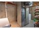 Basement utility area featuring exposed pipes and insulation, a water heater, and shelving at 6530 Grant Wood Ct, Indianapolis, IN 46256