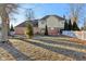 Backyard view showcasing mature trees, a white fence, and the home's exterior at 6878 Black Oak East Ct, Avon, IN 46123