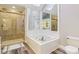 Bathroom features a large soaking tub, stand-up shower, and modern tile flooring at 6878 Black Oak East Ct, Avon, IN 46123