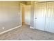Clean bedroom with closet and neutral walls offering a blank canvas at 6878 Black Oak East Ct, Avon, IN 46123