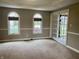 Bonus room with neutral carpeting, white trim, arched windows, and glass French doors at 6878 Black Oak East Ct, Avon, IN 46123