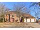 Charming two-story brick home with three-car garage and mature trees in a lovely neighborhood at 6878 Black Oak East Ct, Avon, IN 46123
