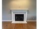 Close-up of the fireplace featuring white mantle and tile at 6878 Black Oak East Ct, Avon, IN 46123