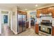 Well-lit kitchen featuring stainless steel appliances, cherry cabinets and granite countertops at 6878 Black Oak East Ct, Avon, IN 46123
