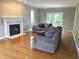 Bright living room with fireplace, hardwood floors, and access to the outdoors at 6878 Black Oak East Ct, Avon, IN 46123