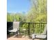 Relaxing deck area featuring comfortable seating and a tranquil view of the surrounding greenery at 700 Greenford N Trl, Carmel, IN 46032