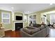 Inviting living room with fireplace, a mounted TV and large sofa, offering a comfortable gathering space at 700 Greenford N Trl, Carmel, IN 46032