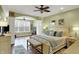 Spacious main bedroom with elegant archway, ceiling fan, and abundant natural light at 700 Greenford N Trl, Carmel, IN 46032