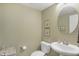Charming half bathroom with a pedestal sink and decorative accents at 700 Greenford N Trl, Carmel, IN 46032
