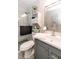 Bathroom featuring a shower, vanity, and toilet at 7221 Broyles Ln, Indianapolis, IN 46217