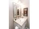 Bathroom featuring a white granite vanity, modern fixtures, and bright lighting at 7221 Broyles Ln, Indianapolis, IN 46217