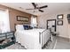Bedroom with a large bed, a ceiling fan, and neutral-colored walls at 7221 Broyles Ln, Indianapolis, IN 46217