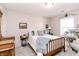 Bedroom with a large bed, natural light, and carpeted floors at 7221 Broyles Ln, Indianapolis, IN 46217
