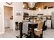 Cozy dining area next to the kitchen features views to a breakfast bar and the living room at 7221 Broyles Ln, Indianapolis, IN 46217