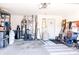 Spacious two car garage with water heater and organizational items at 7221 Broyles Ln, Indianapolis, IN 46217