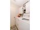 Laundry room with a washer and dryer, overhead cabinets and utility shelving at 7221 Broyles Ln, Indianapolis, IN 46217