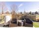 Comfortable backyard patio area with furniture set, grill, and privacy fence at 7221 Broyles Ln, Indianapolis, IN 46217