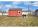 Backyard featuring a red shed and green grass at 817 Hamilton St, Lebanon, IN 46052