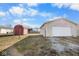 View of the backyard, showcasing both the garage and the shed at 817 Hamilton St, Lebanon, IN 46052
