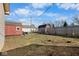 Spacious backyard featuring a shed, swing set, and mature trees at 817 Hamilton St, Lebanon, IN 46052