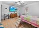 Bedroom featuring TV, wooden dresser and window offering a cozy and functional living space at 817 Hamilton St, Lebanon, IN 46052