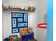 closet with dinosaur quilt, toys, and a basketball hoop for an organized play space at 817 Hamilton St, Lebanon, IN 46052