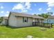 A single-story home with light siding and a front ramp for easy access at 817 Hamilton St, Lebanon, IN 46052