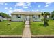 Charming one-story home featuring a well-manicured lawn and inviting walkway at 817 Hamilton St, Lebanon, IN 46052