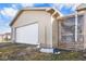 Attached garage with white door and adjacent screen room at 817 Hamilton St, Lebanon, IN 46052
