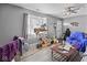 A living room showcasing natural light, hardwood floors, and eclectic décor, blending comfort and unique character at 817 Hamilton St, Lebanon, IN 46052