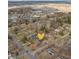 Aerial view of a home surrounded by mature trees and neighboring houses in a quiet residential area at 8401 N College Ave, Indianapolis, IN 46240