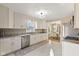 Well-lit kitchen boasting stainless steel appliances, granite countertops, and modern cabinets at 8401 N College Ave, Indianapolis, IN 46240