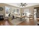 Bright living room with large windows, comfortable seating, and a stylish rug at 8401 N College Ave, Indianapolis, IN 46240
