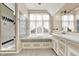 Bathroom features a soaking tub, tiled shower, and vanity at 897 Copperwood Dr, Carmel, IN 46033