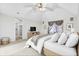 Cozy bedroom featuring vaulted ceiling, neutral paint, plush rug and an ensuite bath at 897 Copperwood Dr, Carmel, IN 46033