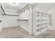 Walk-in closet features ample shelving and clothing rods at 897 Copperwood Dr, Carmel, IN 46033