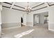 Spacious dining room with coffered ceilings and open layout to adjacent rooms at 897 Copperwood Dr, Carmel, IN 46033