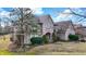 Beautiful brick home featuring mature trees and well-maintained grounds at 897 Copperwood Dr, Carmel, IN 46033