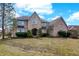 Beautiful brick house exterior with manicured lawn and mature landscaping enhancing curb appeal at 897 Copperwood Dr, Carmel, IN 46033