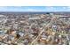 A high-angle provides an overview of the neighborhood with a mix of residential homes, local amenities, and a glimpse of city life at 912 Harlan St, Indianapolis, IN 46203