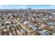 An elevated captures rows of diverse homes with the city skyline visible in the distance, showcasing the urban-suburban mix at 912 Harlan St, Indianapolis, IN 46203