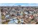 A high-angle perspective captures the neat rows of colorful homes under a clear sky with city skyline far in the distance at 912 Harlan St, Indianapolis, IN 46203