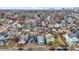 A high-angle shows colorful, well-kept homes in a quiet neighborhood, complete with tree-lined streets and vibrant landscaping at 912 Harlan St, Indianapolis, IN 46203