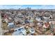 An aerial view of the property highlighting its location within a vibrant neighborhood with a distant skyline at 912 Harlan St, Indianapolis, IN 46203