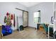 Bright bedroom with wood floors, featuring a barn door and a dedicated desk area at 912 Harlan St, Indianapolis, IN 46203