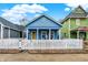 Charming blue home with white picket fence and inviting front porch at 912 Harlan St, Indianapolis, IN 46203