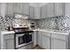 Stylish kitchen featuring stainless steel appliances, granite countertops, and ample cabinet space at 912 Harlan St, Indianapolis, IN 46203